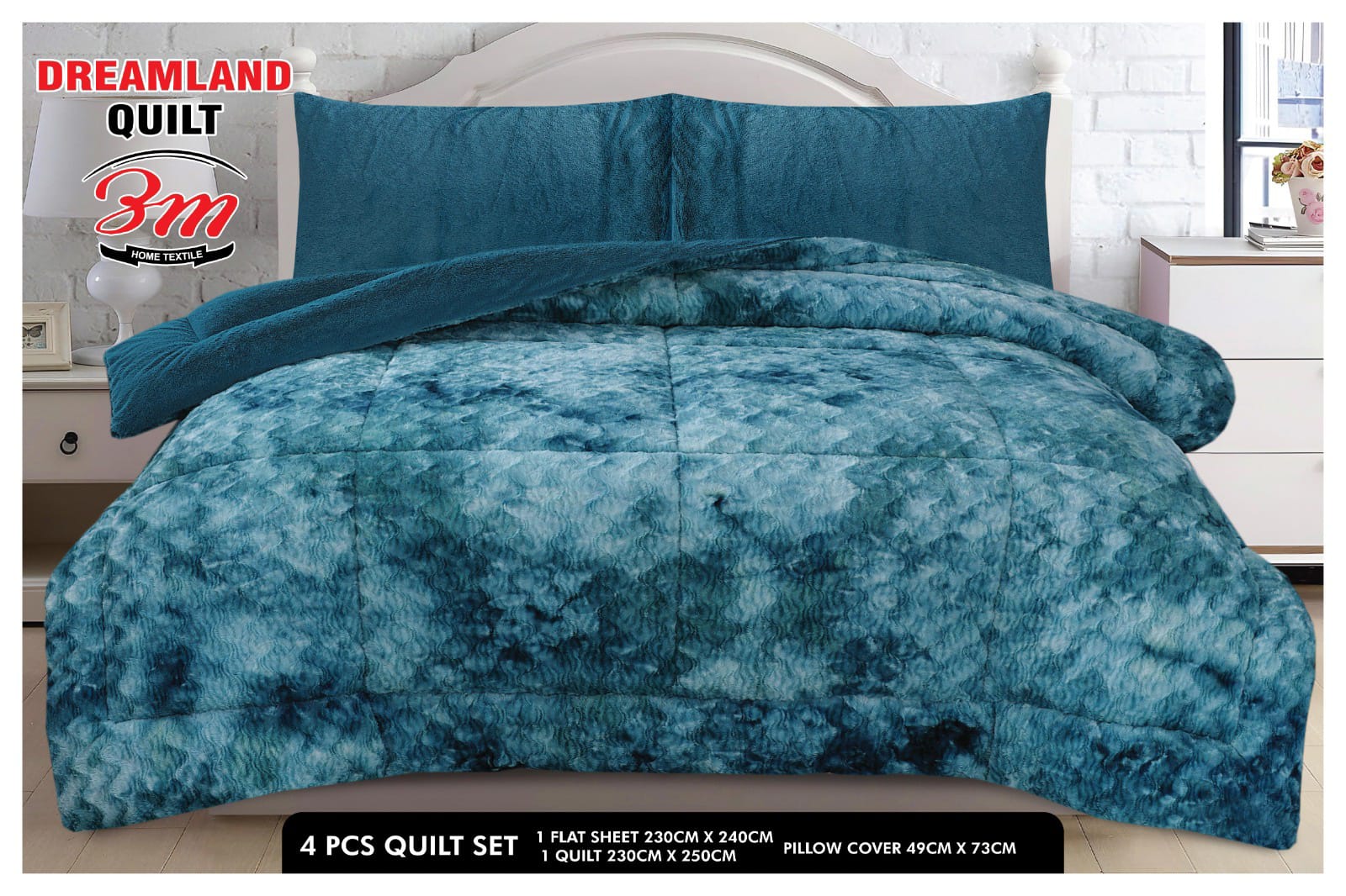 Blue quilt set with pillow covers on a bed, featuring Dreamland Quilt branding.